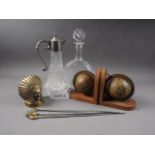A pair of glass decanters and stoppers, two others, a pair of bookends, formed as globes, meat