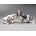 A Raku pottery model spaniel, 8 3/4" high, and another similar Raku pottery model of a pig