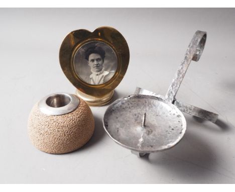 A Royal Doulton silver mounted table vesta, a hammered pewter candle table pricket and a brass heart-shaped photo frame 