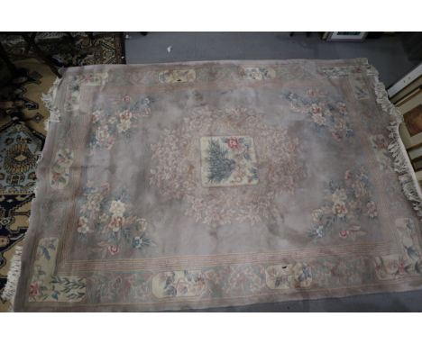 A Chinese contour pile carpet with all-over traditional floral design on a mushroom ground, 84” x 120” approx 