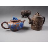 A Chinese Yixing pottery teapot with painted floral decoration and monkey finial, 3 3/4" high (