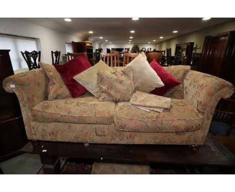 A chesterfield type settee with loose seat and back cushions, upholstered in a floral tapestry, 74" wide x 36" deep x 29 1/2"