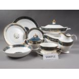 A Royal Doulton "Carlisle" pattern bone china dinner service for eight, including tureens, gravy