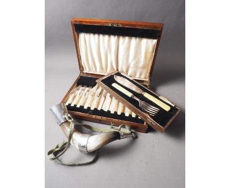 A part canteen of mother-of-pearl handled silver plated fruit knives and forks, a fish serving set, and a pewter mounted drin