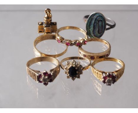 Five 9ct gold dress rings, 11.65g, an 18ct gold, ruby and diamond dress ring, 4.1g, a silver gilt charm, formed as the White 