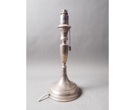 A filled silver table lamp, on circular stepped base, 14 1/2" high overall 