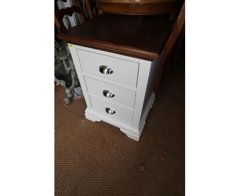 A light grey and walnut top bedside cupboard, fitted three drawers, 18" wide x 16 1/2" deep x 27" high 