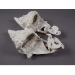 A pair of late 19th century Royal Worcester blanc-de-chine wall pockets, formed as humming birds,