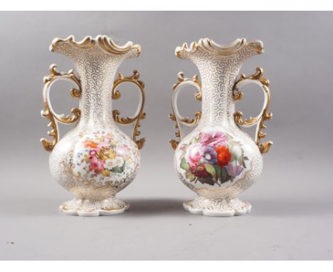 A pair of early 19th century Worcester bulbous flared rim vases with gilt scrolled handles and gilt and floral decoration, 11