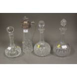 A silver plate mounted and cut glass claret jug with lion finial, 12 1/2" high, and three clear