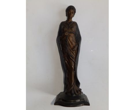 A bronze female figure in long, tightly drawn gown, 12” high.