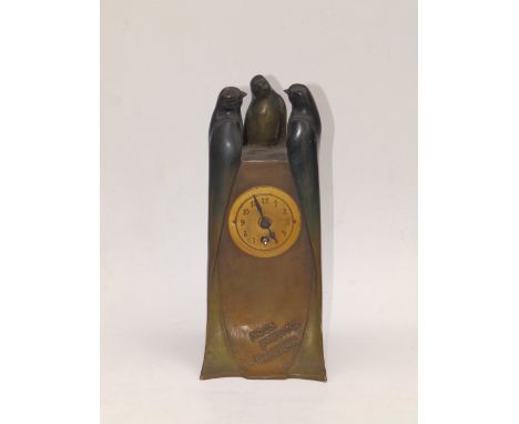 An art nouveau bronze mantel clock by A. Puchegger (Austrian), the slightly tapering rectangular case surmounted by three swi