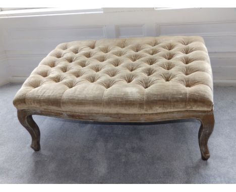 A large modern reproduction style button-upholstered stool in the French style on cabriole legs, 40” x 28”.