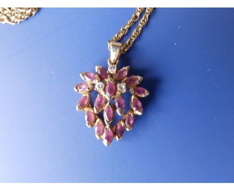 A ruby &amp; diamond set necklace pendant.