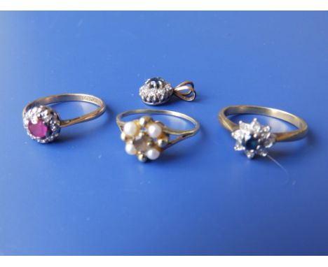 A small ruby &amp; diamond cluster ring, two other cluster rings and a pendant. (4)