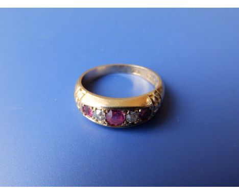 A five stone ruby &amp; diamond ring. Finger size M.