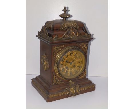 A gilt-metal mounted bracket clock in the French style, the eight day movement with rectangular plates striking on a gong, 16