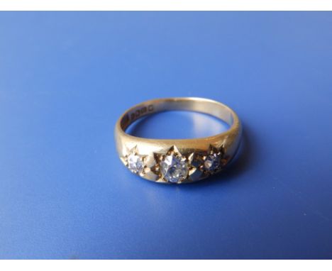 A gent's 18ct gold three stone diamond ring – centre stone approximately 0.50 carat. Finger size V.