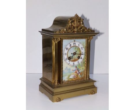 A 19thC French brass cased eight day gong striking mantel clock, the rectangular porcelain dial painted with a scene depictin