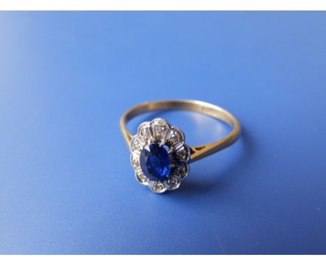 A small oval sapphire &amp; diamond cluster ring – 18ct &amp; Plat.  Finger size R.