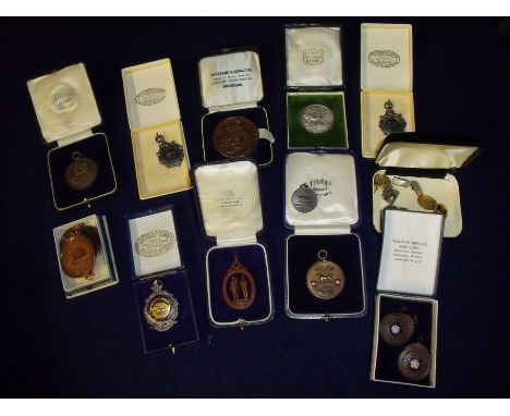 Collection of military medallions. fobs and pendants, mostly relating to the West Yorkshire Regiment including silver hallmar