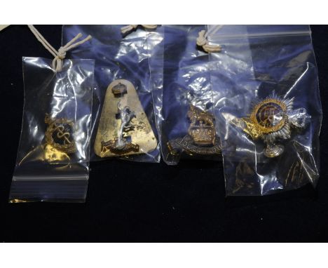 Queens Crown Army Service Corp. cap badge and buttons, a Queens Crown Royal Army Paid Corp. badge and buttons, Army Medical C