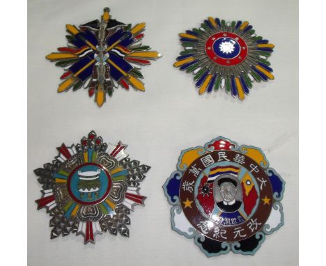 Group of four Chinese silver and enamel military breast badges, each with various characters and signature panels to the reve