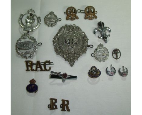 Various cap badges and lapel badges for various British units including Royal Tank Corp, RAC, Argyle & Sutherland, brass & en