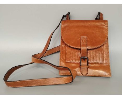 Circa 1990s Yves Saint Laurent Tan Leather Cross Body Bag, with stitched ribbed pocket to the front, buckle fastening and pri