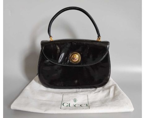 Circa 1980s Gucci Black Patent Handbag, with gilt-tone hardware, unusual decorative enamel tigers head turn lock, navy suede 