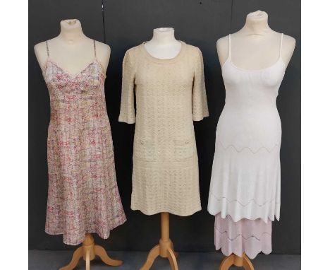 Chanel Clothing comprising a cream cotton a-line drop waist dress of woven design with round neck, elbow length sleeves, two 