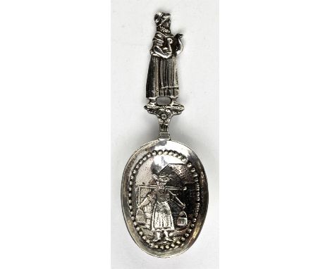 Edwardian silver caddy spoon with handle in the form of a maid holding two birds . Imported, London 1907.