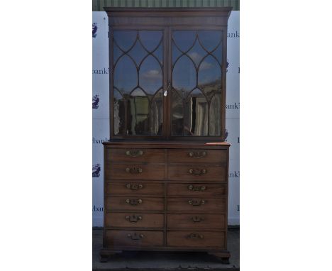 George lll mahogany secretaire bookcase, the upper section with glazed doors enclosing two shelves, the lower with central do