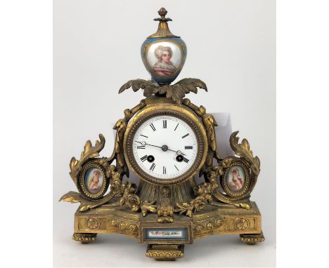 A French spelter and Sevres style porcelain clock, late 19th Century, with key and no pendulum, 34cm high