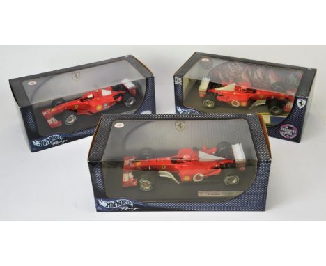 Hot Wheels Racing - Three Boxed Mattel Ferrari 1:18 scale models, Michael Schumacher F2001 and F-2002 and Premier 2003 editio