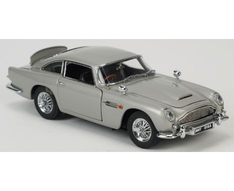 James Bond 007 Aston Martin DB5 (1964), Danbury Mint 1:24 scale authorised replica model of the car driven by Bond in Goldfin