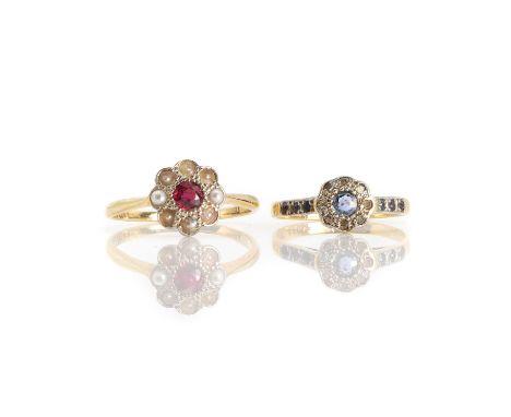 A ruby and seed pearl flowerhead cluster ring,with a round cut ruby in a millegrain setting with eight seed pearl petals to a