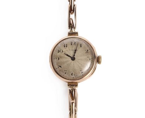 A ladies 9ct gold Rolex mechanical bracelet watch, c.1923,23mm diameter, a silvered guilloché enamel dial with Arabic numeral