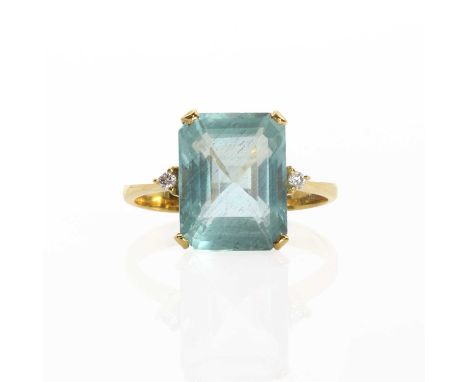 An aquamarine and diamond ring,an octagonal cut aquamarine, 9.40mm x 12.05mm, four claw set to the centre, flanked by a small