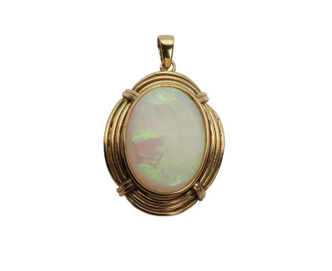 A gold single stone opal pendant,an oval cabochon light opal, 14.50mm x 20.00mm, bezel set within a three row wire surround, 