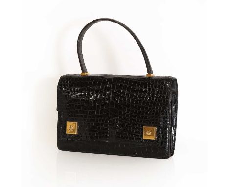 A Hermes black crocodile leather Piano bag. gold tone hardware, single flat handle, stud closure, the interior with press stu