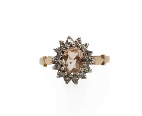 A 9ct gold morganite and diamond cluster ring, centring an oval mixed cut morganite within a surround or single cut diamonds,