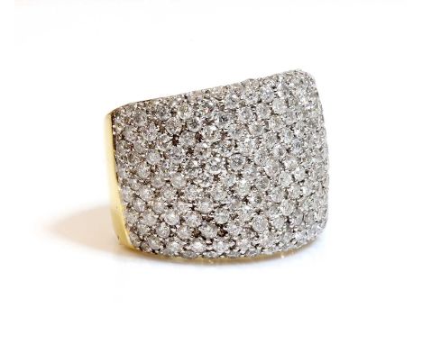 A Continental two colour gold diamond set canopy ring, with graduated brilliant cut diamonds, pavé set to the white head, wit