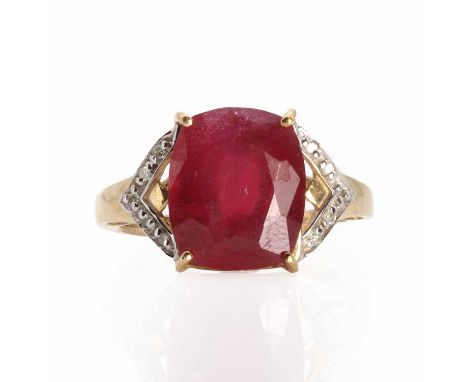 A 9ct gold ruby and diamond ring,  with a cushion cut ruby with a stated weight of 7.56ct, four claws set in a pierced collet