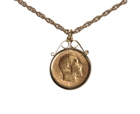 A 1908 half sovereign pendant and chain,the coin spectacle set to a scrolling mount, London 1980. Suspended on a base metal c