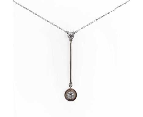 A gold Edna May style diamond drop necklace,with an old European cut diamond, millegrain set to a plain wire surround, suspen
