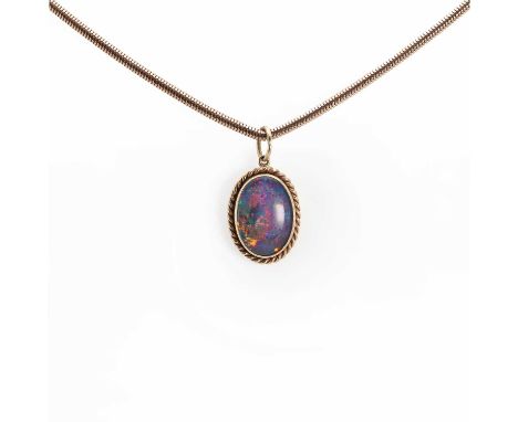 A 9ct gold opal triplet pendant,with an oval opal triplet cabochon, bezel set to a twist wire surround, 15mm x 19mm, suspende