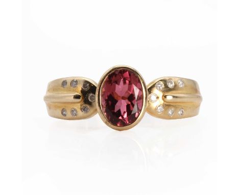A 9ct gold tourmaline and diamond ring,  with an oval mixed cut tourmaline with a stated weight of 1.38ct, rub set in a plain