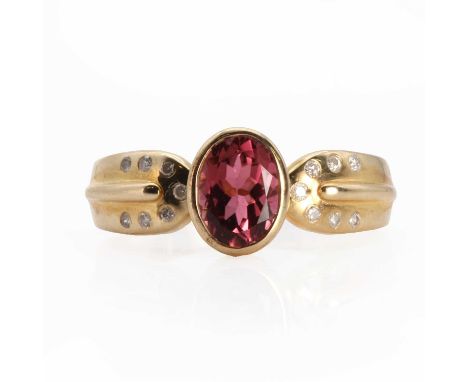 A 9ct gold tourmaline and diamond ring,  with an oval mixed cut tourmaline with a stated weight of 1.38ct, rub set in a plain