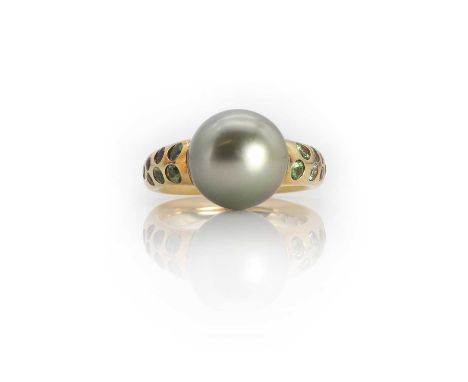 A single stone Tahitian cultured pearl ring with gem set shoulders, the 12.50mm Tahitian cultured pearl, set between deeply r